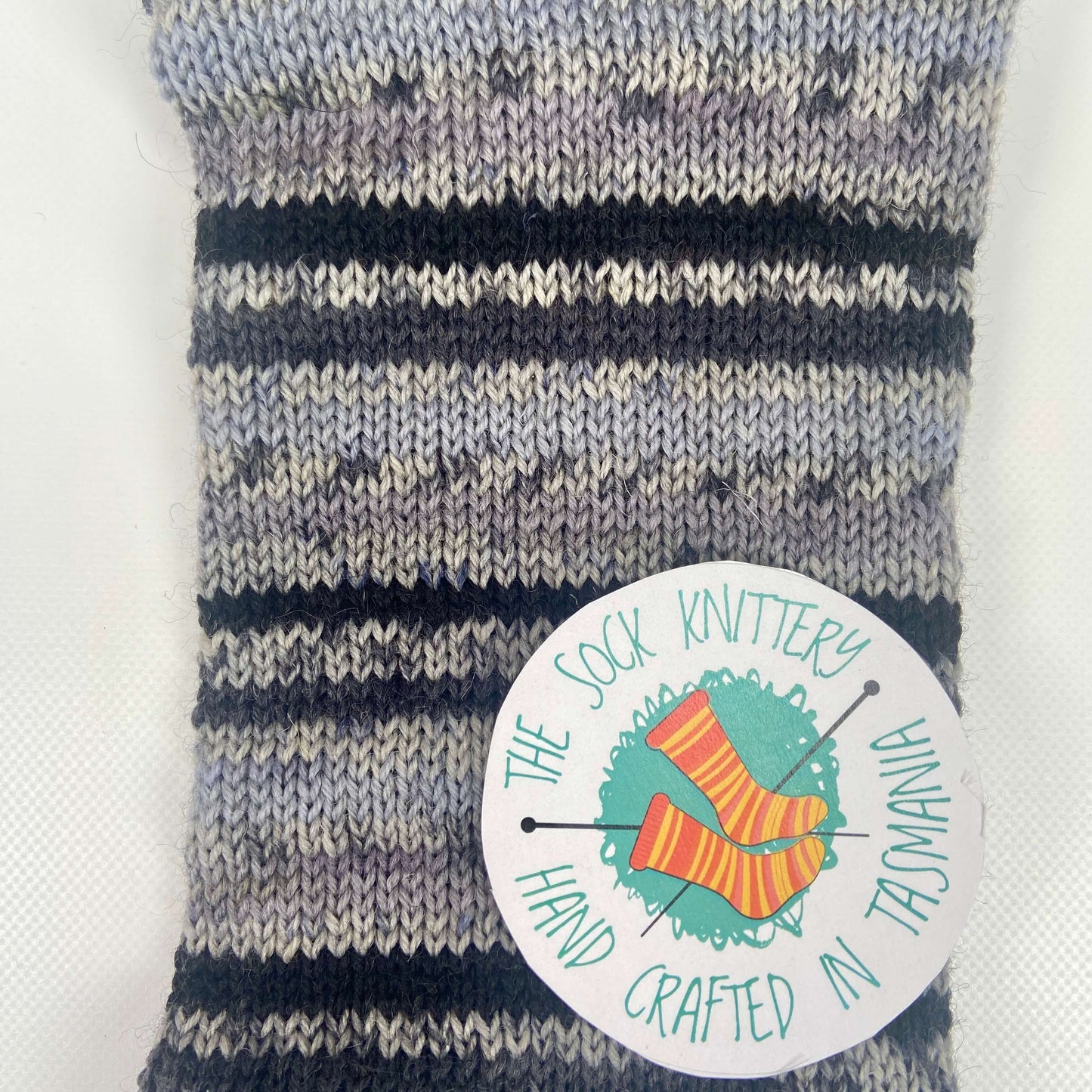 example of what the striped sock yarn will look like in black and grey - The Sock Knittery