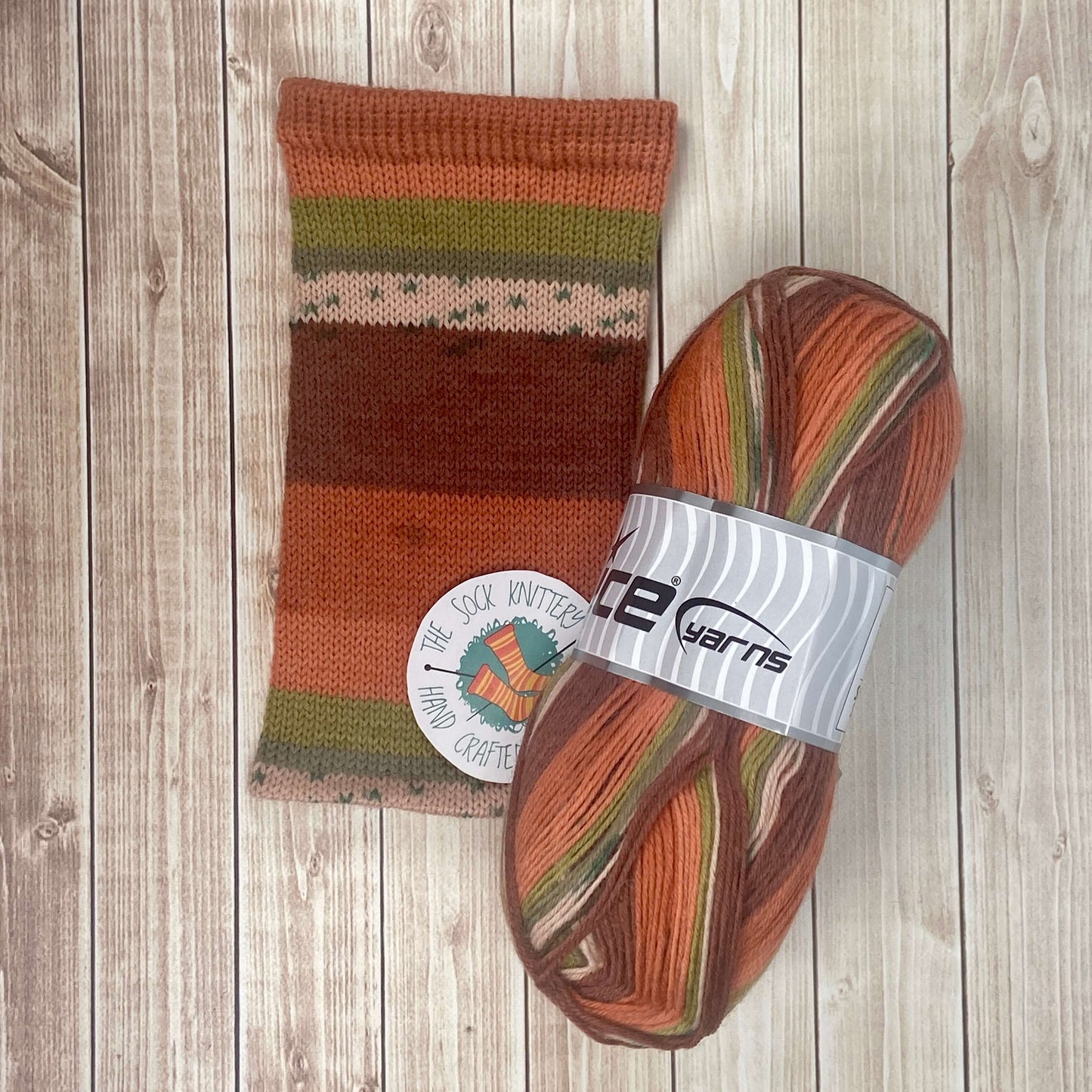 striped sock yarn by ice yarns - brown green orange and copper colors - The Sock Knittery