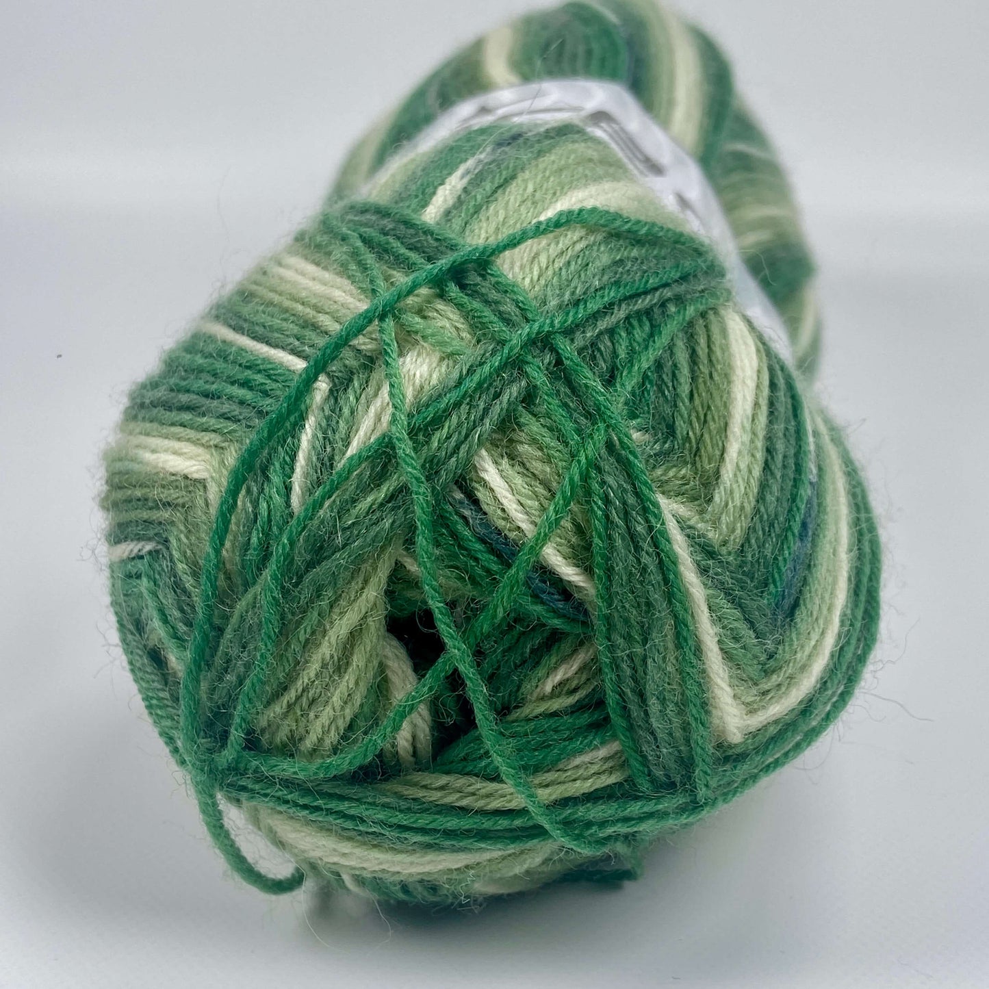 ball of sock yarn by Ice Yarns in green shades - The Sock Knittery