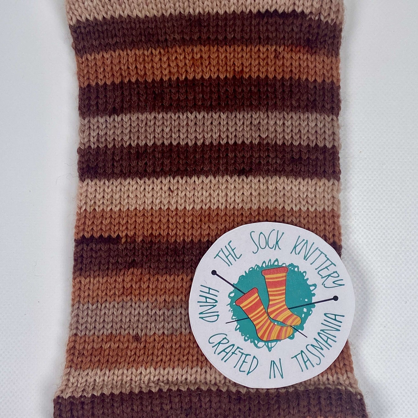 sample of striped sock yarn in brown shades - The Sock Knittery