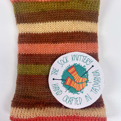 example of knitted sock yarn in brown, orange, green, salmon - The Sock Knittery